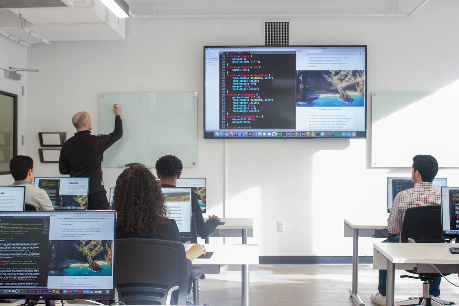 photo of instructor writing on whiteboard