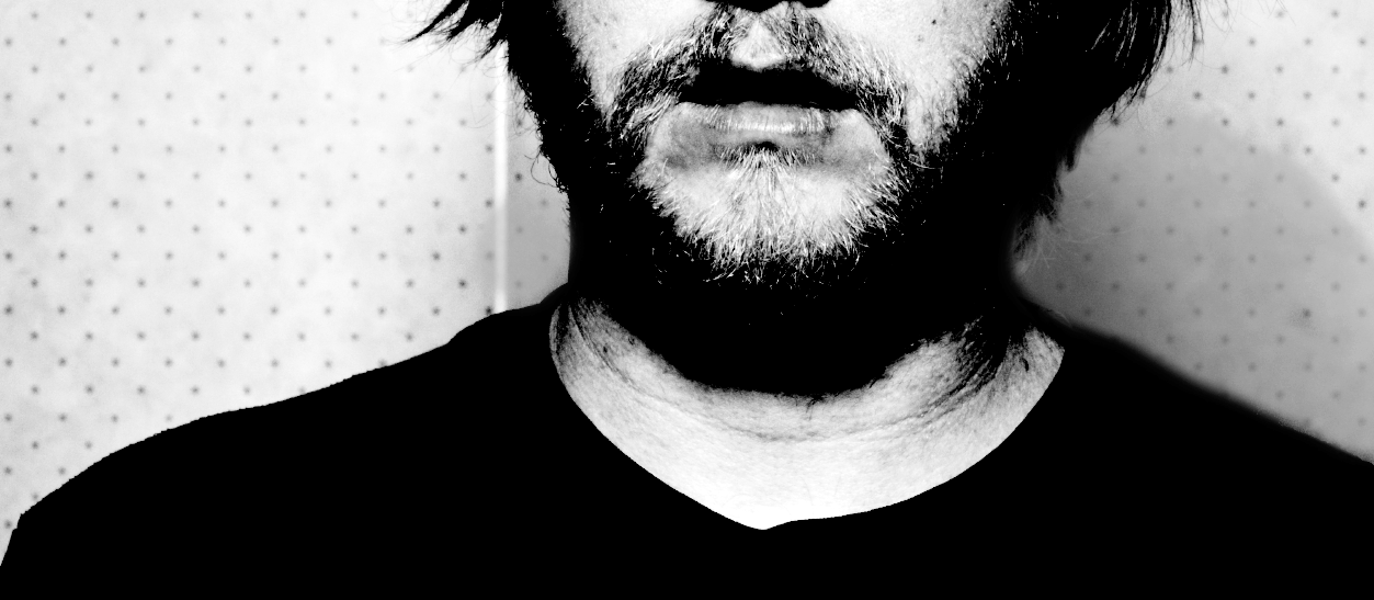 Before and after example of using the History Brush tool to clean shadows around the neck area